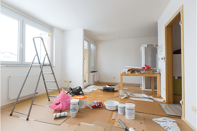 An empty living room in the process of being renovated