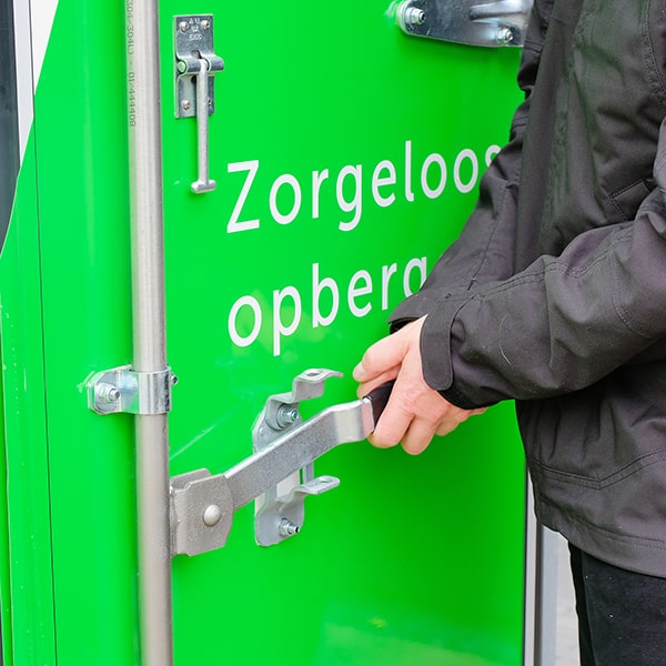 Detail of the door lock of a Large Box as the driver is closing it